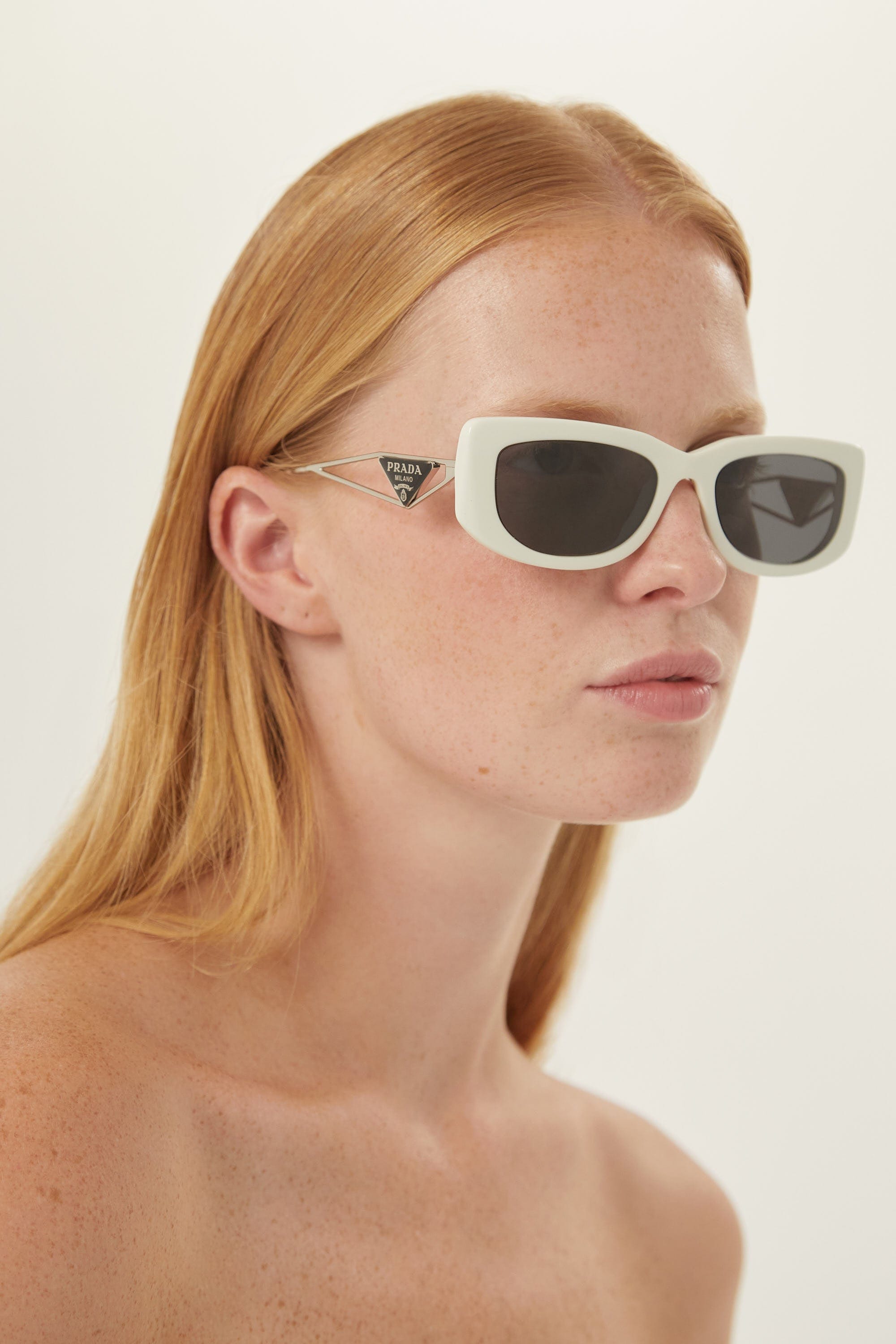 Prada white micro sunglasses with metal temple