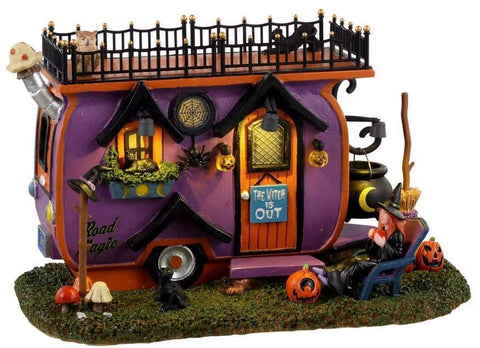 Getting in on the tiny home craze this witch has outfitted an adorable van for herself and her black cats. Appropriately named Road Magic this dwelling on wheels has all the comforts of home from an Adirondack chair and pumpkin ottoman outside to the broom stand and cauldron bubbling with brew. Spiders and spider webs provide the decor while pumpkin lanterns provide a welcoming glow for any friends or family that stop by.