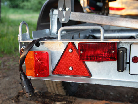 Rear tail lights of a boat trailer