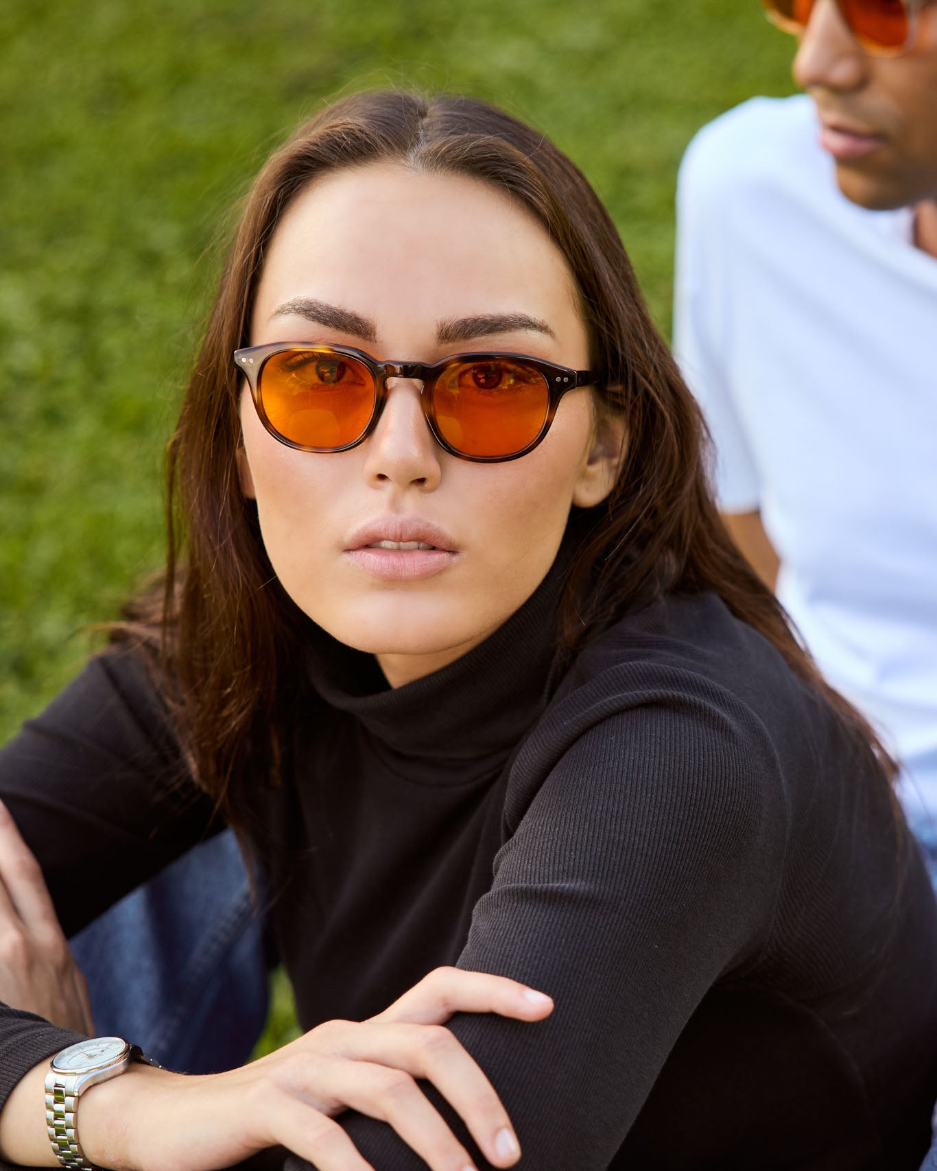 Model is wearing Filter Optix blue light blockers with Orange lenses