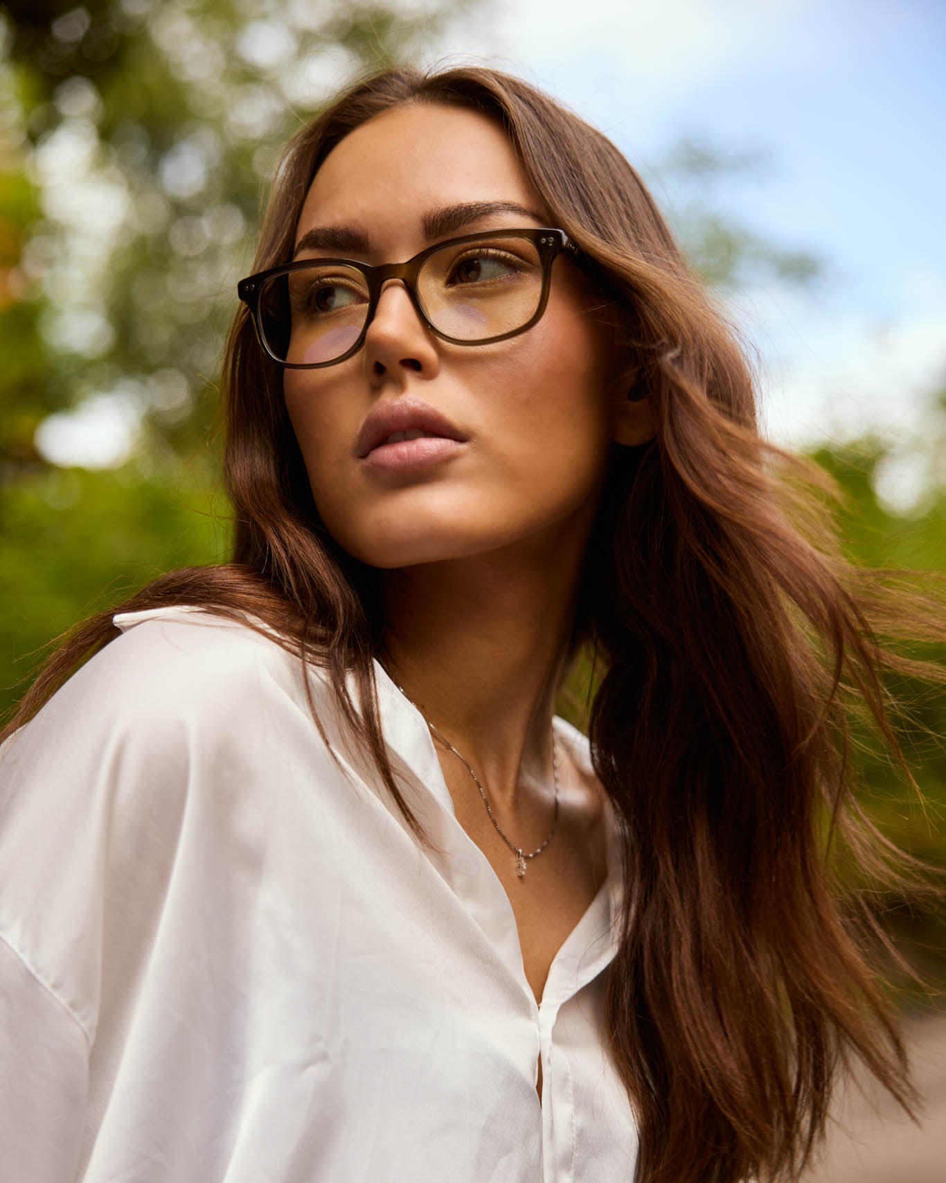 Model is wearing Filter Optix blue light blocking glasses with Clear lenses