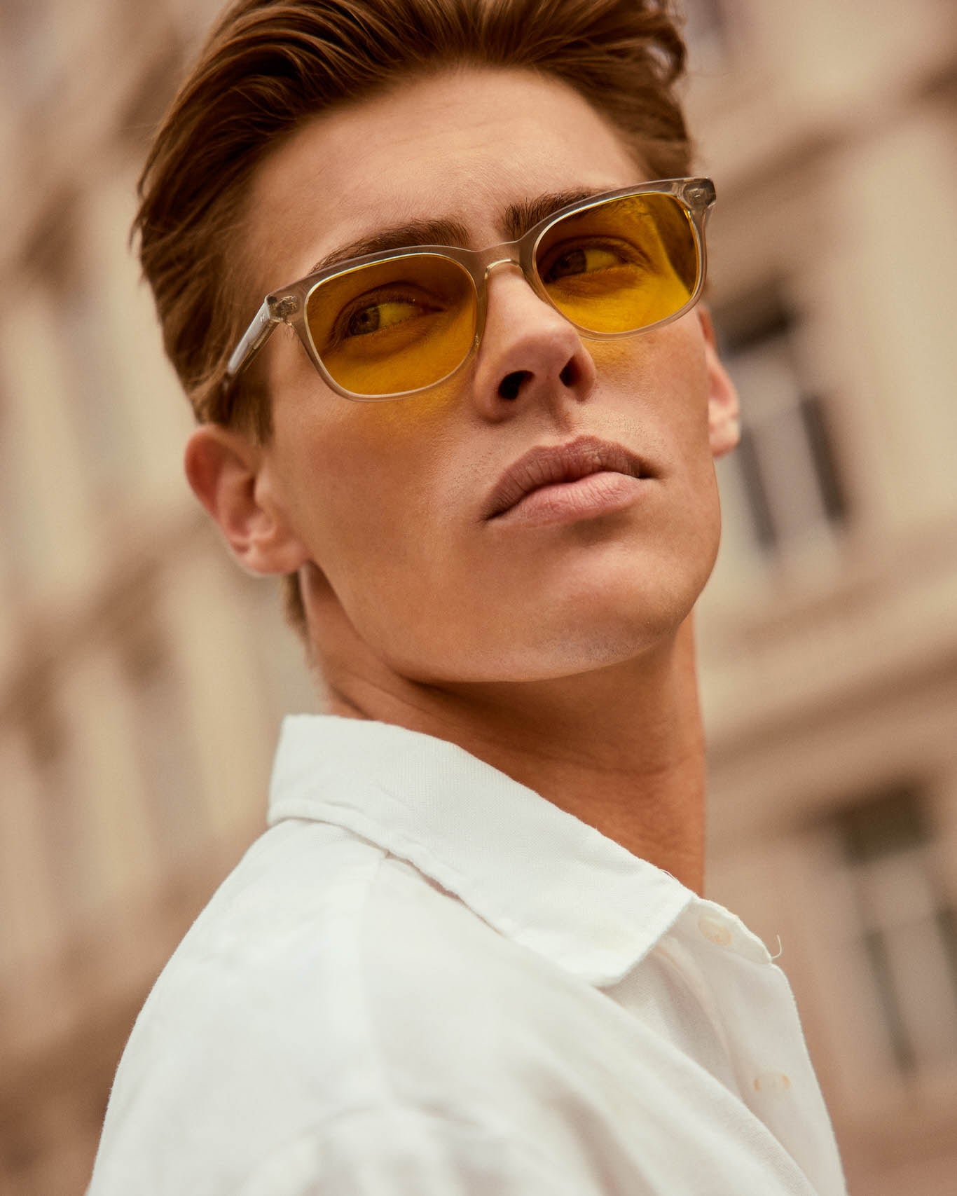 Model is wearing Filter Optix blue blocking glasses with Yellow lenses