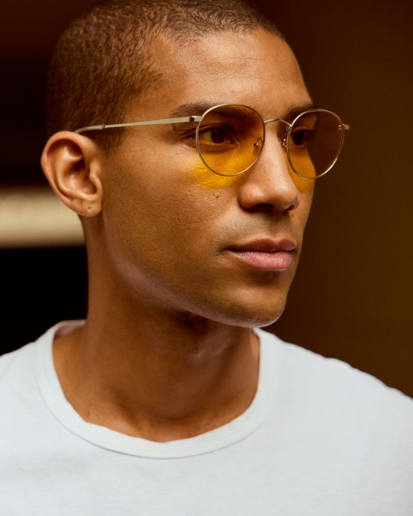 Model is wearing Filter Optix blue light blockers with Yellow lenses