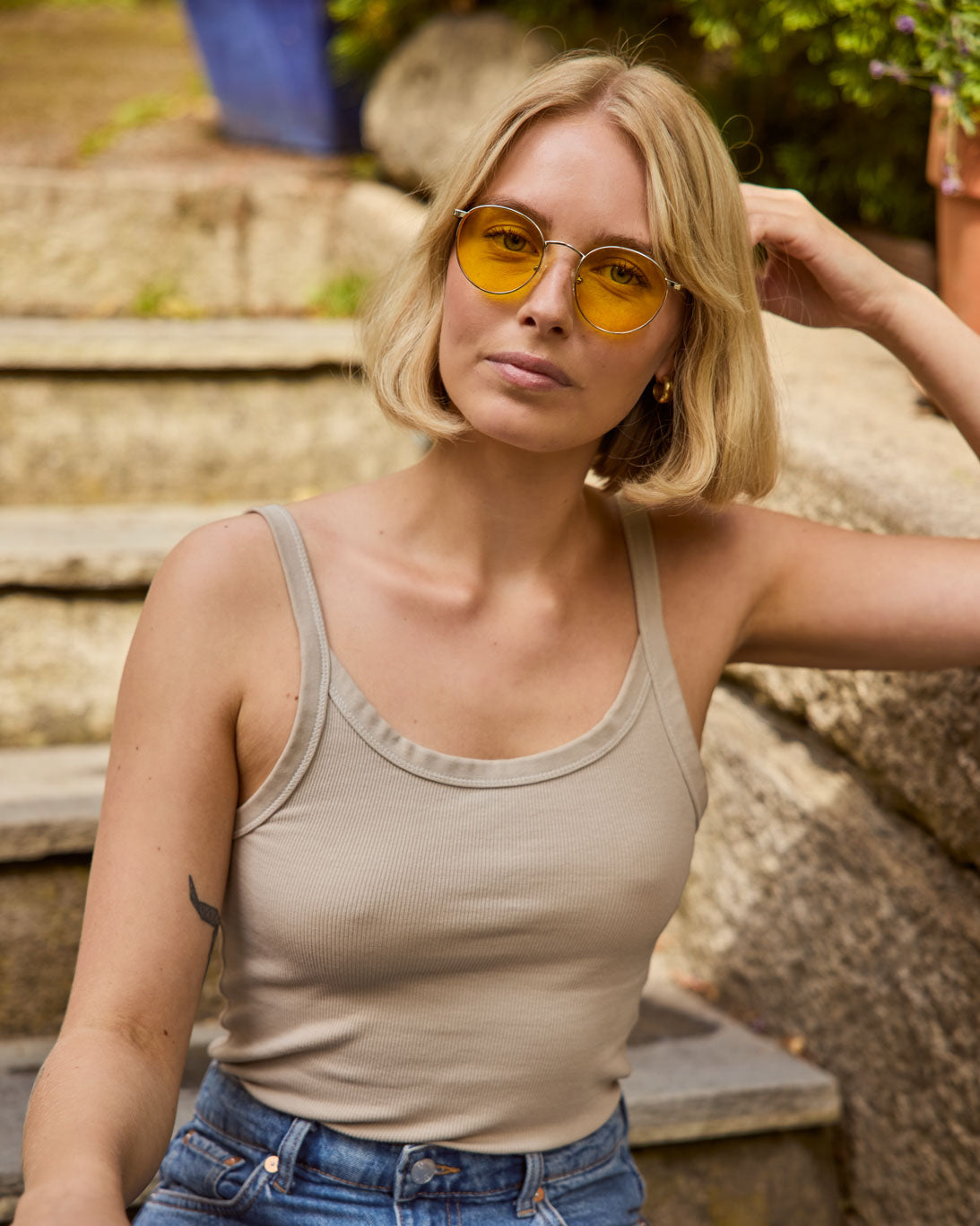 Model is wearing Filter Optix blue blocking glasses with Yellow lenses