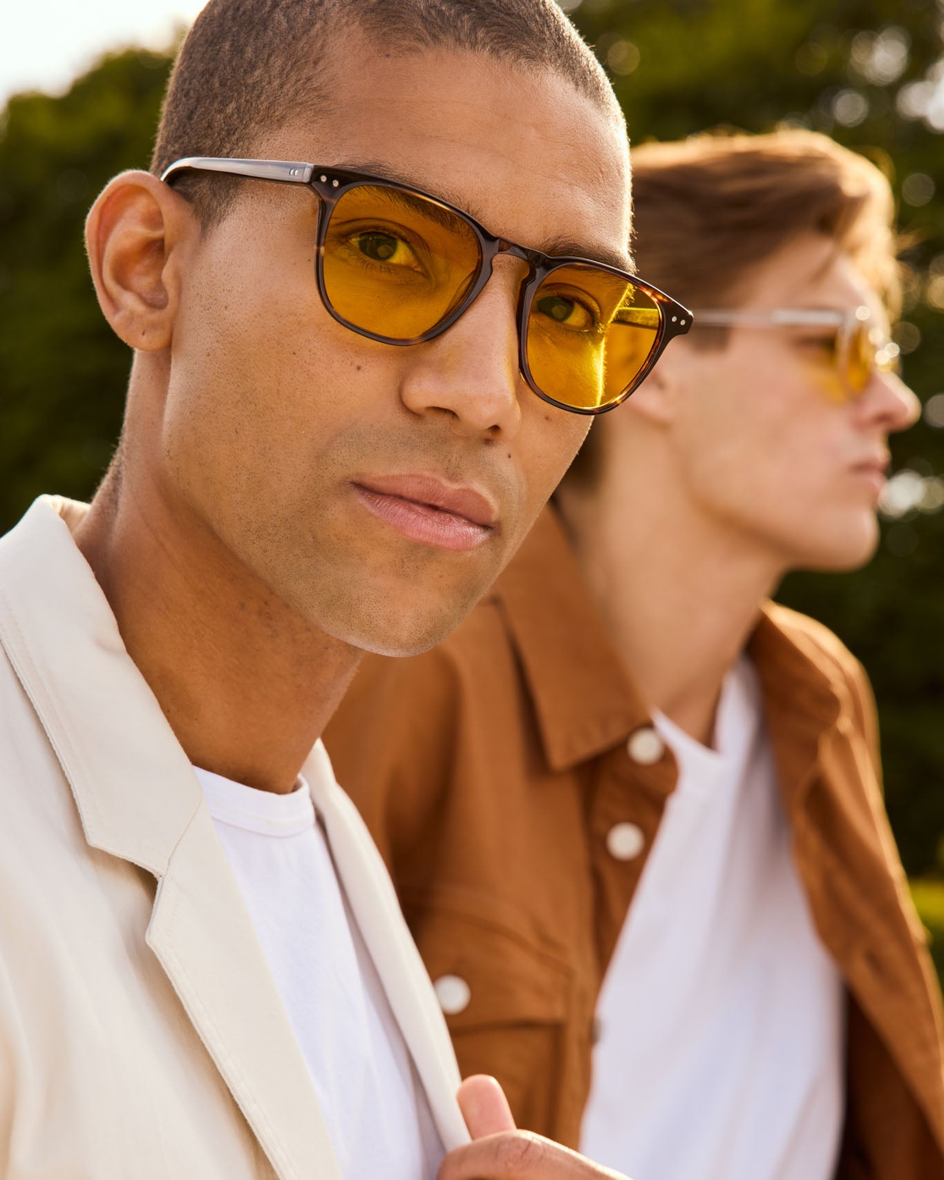 Model is wearing Filter Optix blue light blockers with Yellow lenses