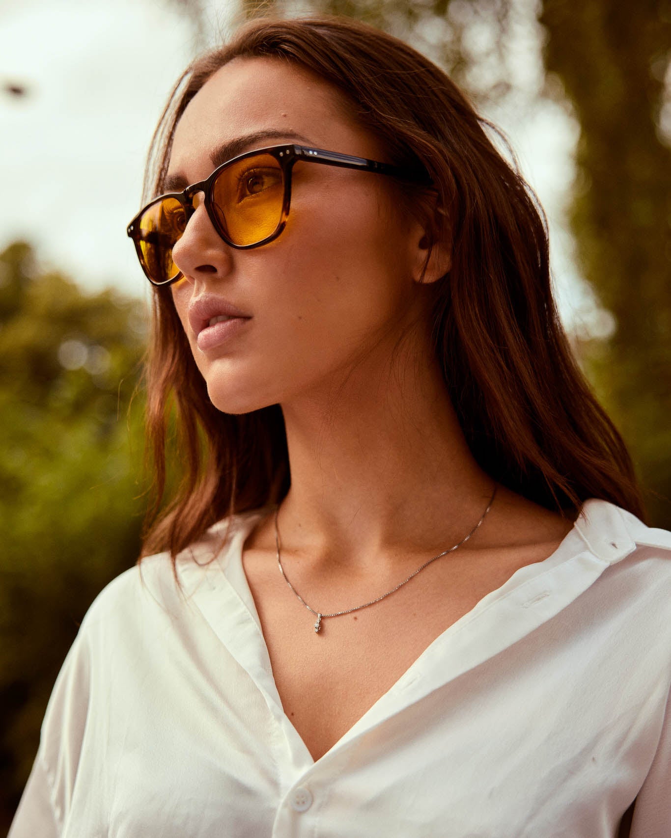 Model is wearing Filter Optix blue blocking glasses with Yellow lenses