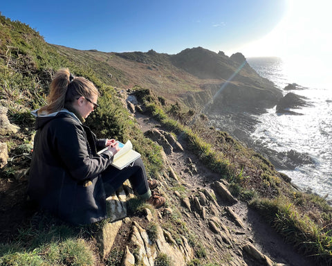 artist Emma Carlisle on the coast path in south Devon, England 