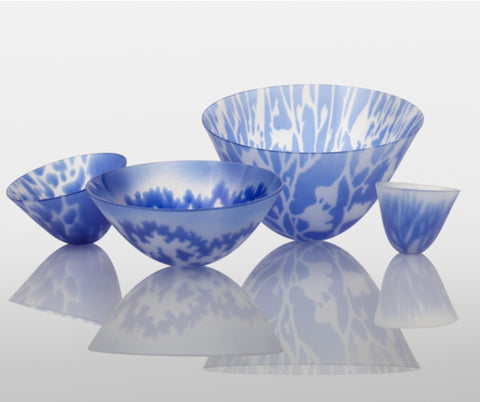 a collection of blue and transparent glass bowls by glass artist Verity Pulford 