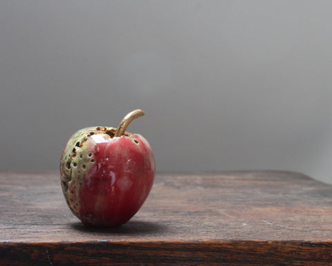 red ceramic apple by remon Jephcott