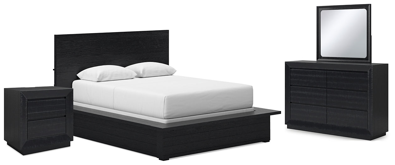 Londer Queen Panel Bed Accompanied by a Mirrored Dresser and Nightstand