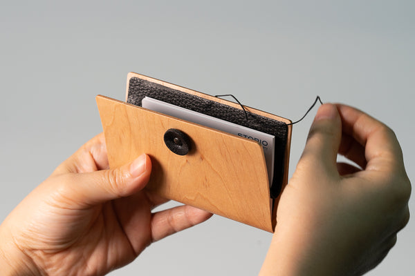 Exchange business cards in a bentwood business card holder and use it as a conversation starter.