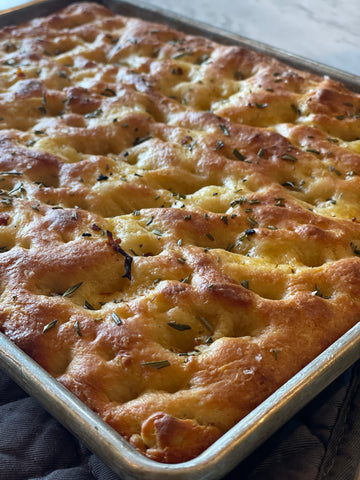 Pan of freshly baked focaccia barese