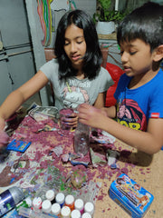 Girl and a boy getting messy with diy kits