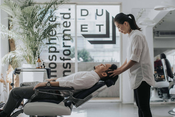 men relax in sculptor barber