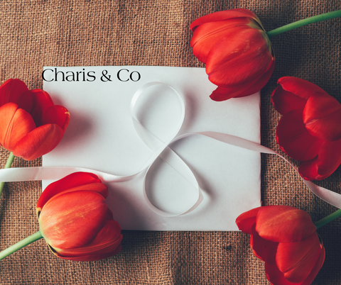 ribbon shaped in a number 8 and tulips on a flatlay