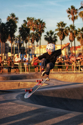 David Cain on skateboard with protection case - OmniRoller