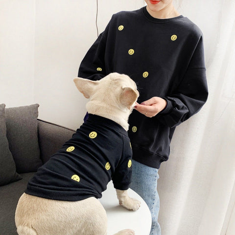 Smiley pet and owner matching sweatshirts