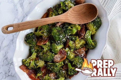 Gluten free roasted broccoli and bacon is shown in a white serving dish.