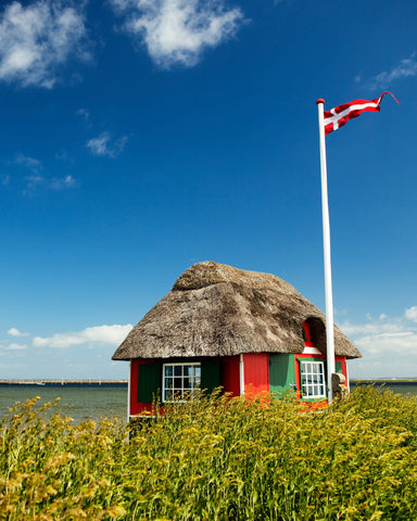 red-summer-house-on-a-beach-in-denmark