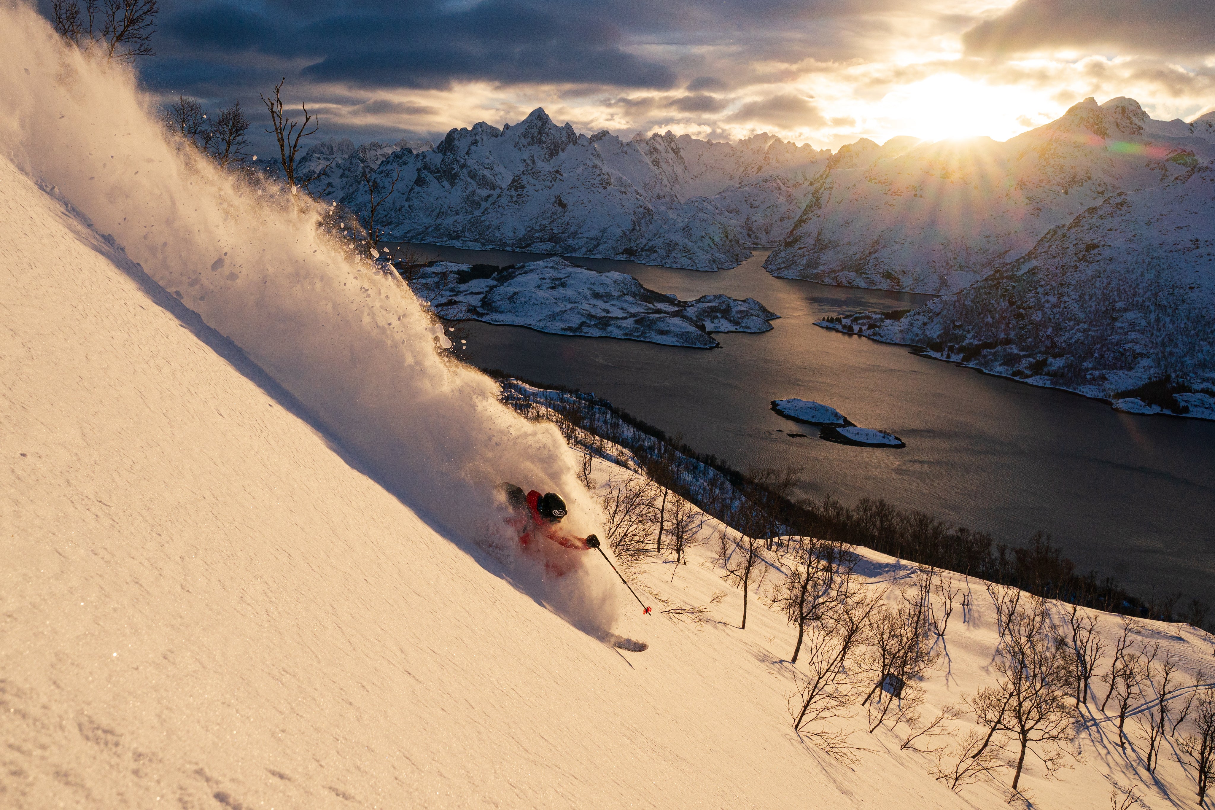 Liam Doran Photography ThinkTank Pro Photo of skier turning in powder as sun sets behind