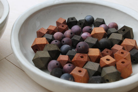 wooden colourful beads in a plate