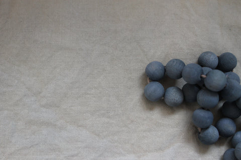 Blue beads and greyish fabric