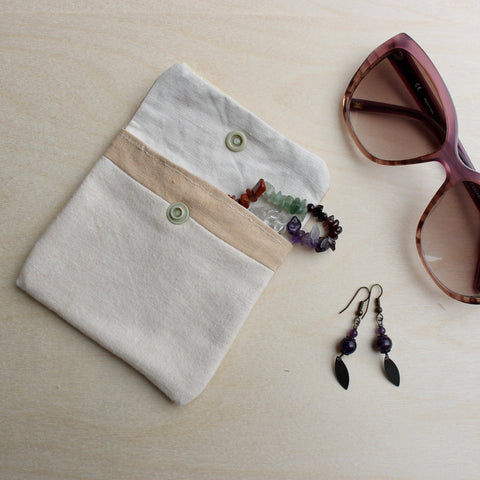 pouch with jewels and sunglasses