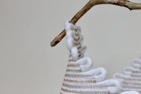 detail of a basket with driftwood