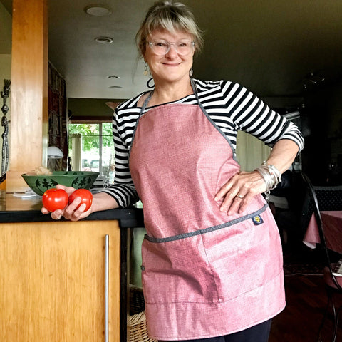 Splash Fabric apron in Falu Red on Tracy in the kitchen