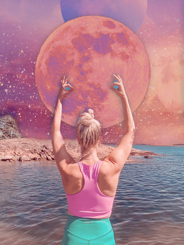 The moon and Anette Tallberg wearing Moonah Wear pink yoga top and super high waist turquoise yoga leggings. 