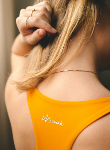 Viivi Amanda wearing Moonah Wear racerback orange yoga top