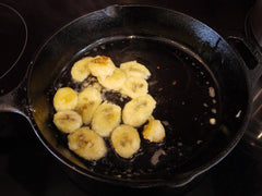 Banana frying in cast iron pan