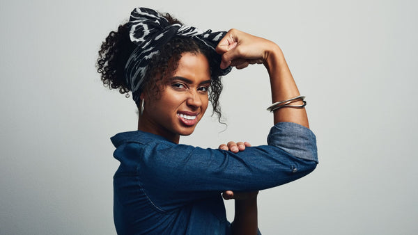 A women flexing her arm like the wartime poster