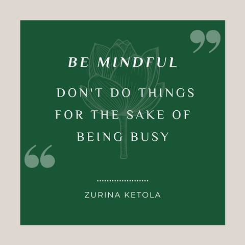 "Be Mindful. Don't do things for the sake of being busy." Quote graphic with green background and pale gray border with a stylized lotus flower image in the center. 