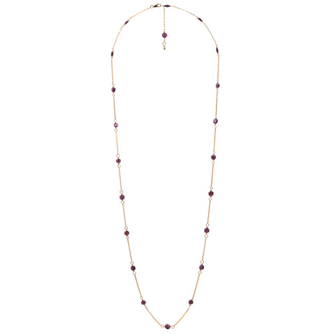 Zurina Ketola's Long Upcycled Garnet Necklace in 14K gold fill on white background. 