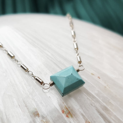 Close up side over view of Zurina Ketola's Turquoise Beaded Pyramid Necklace in sterling silver. 