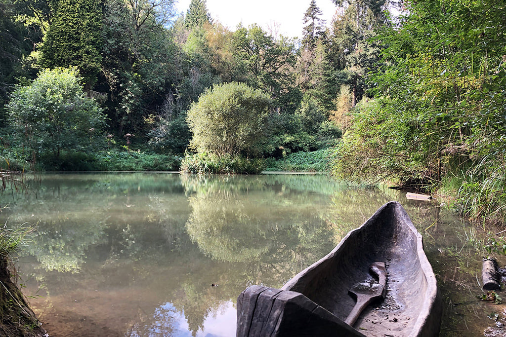Secret lake with handmade wooden canoe