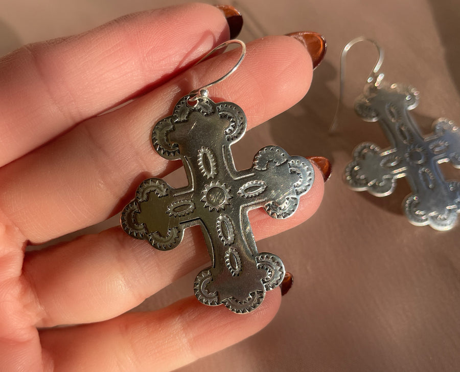 A pair of vintage sterling silver native american navajo cross shaped earrings with hammered stamp details on front