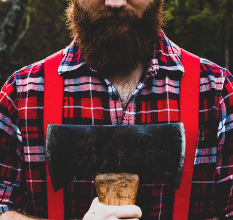 Bearded lumberjack holding an axe