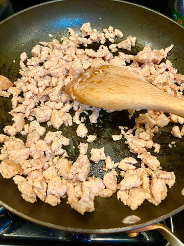 Cooked ground chicken sausage in a skillet