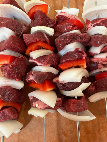 Skewers of elk, onion and red bell pepper ready for the grill