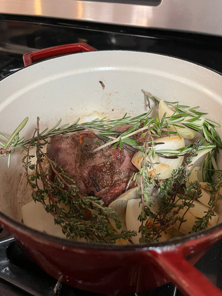 Elk roast and herbs in a dutch oven