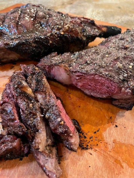 Grilled and sliced bison tomahawk steaks