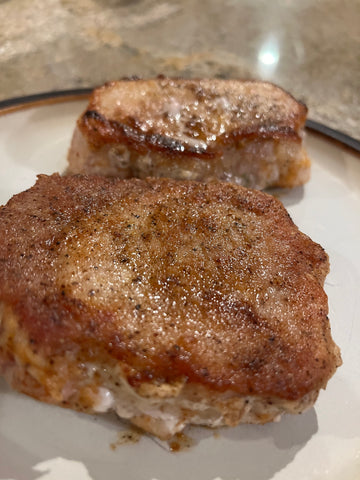 Seared pork chops on a plate