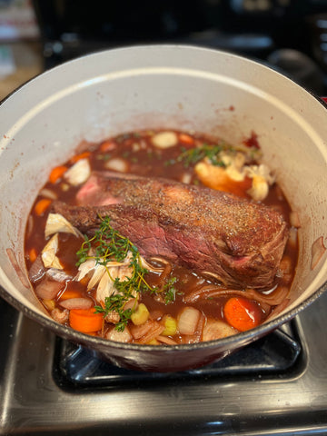 Dutch oven with bison short ribs and vegetables