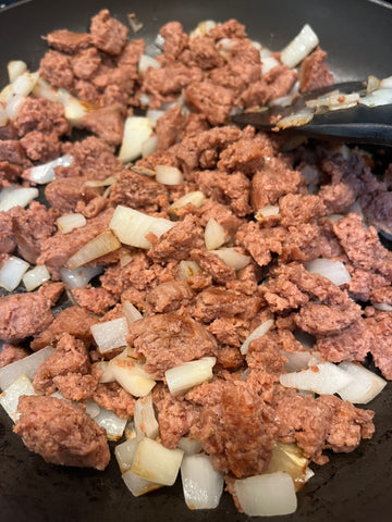 Vegan ground in a skillet with onions