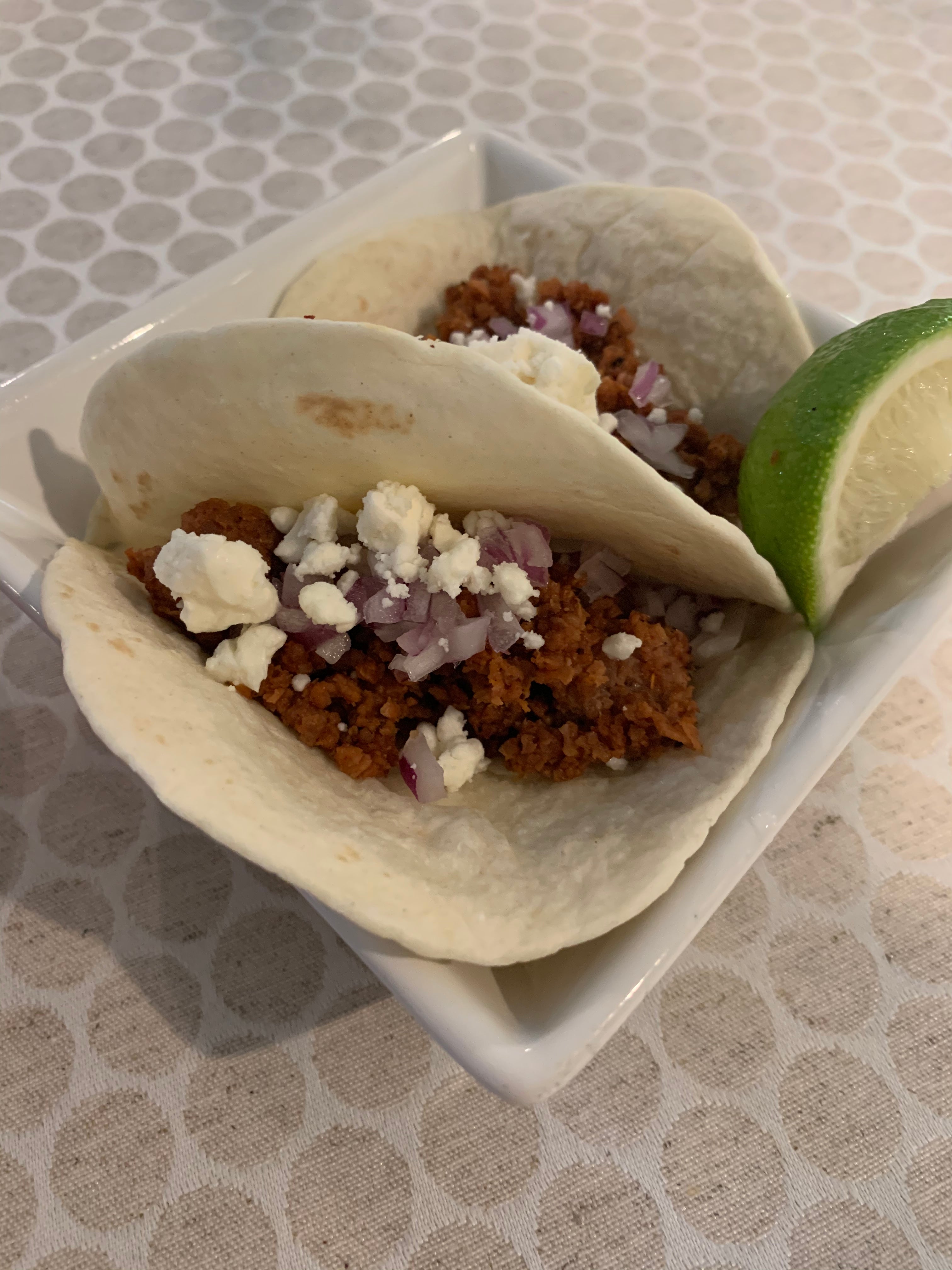 Vegan street tacos in a square white dish
