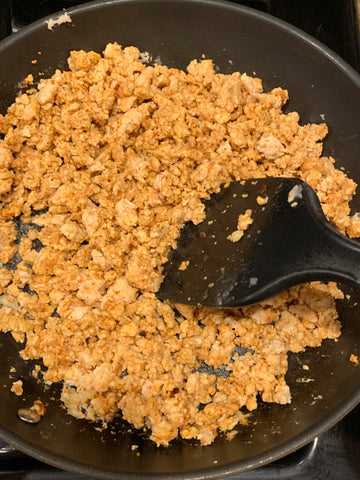 Ground chicken cooking in a skillet