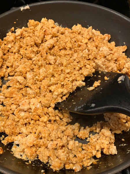 Frontiere Natural Meats ground chicken in a skillet