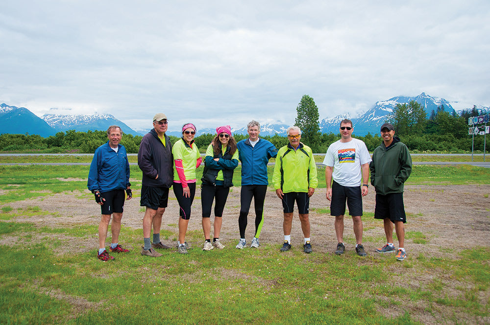 The two teams posing at the finish line